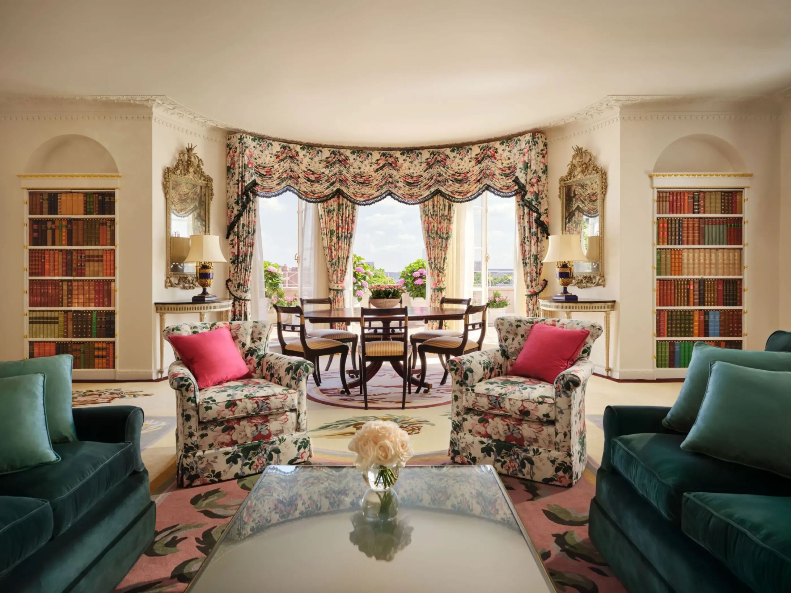 An attractive suite with a dining table and comfortable furnishings