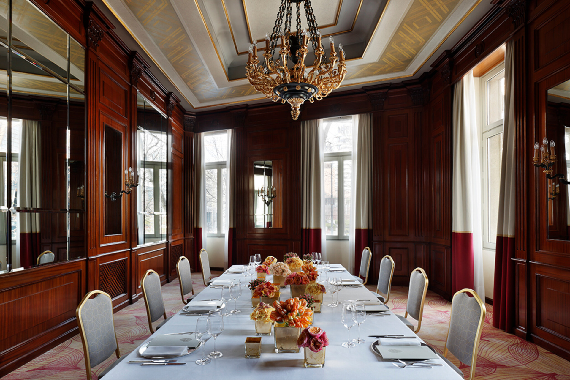 Our Club Principe meeting space with a central table laid for dinner